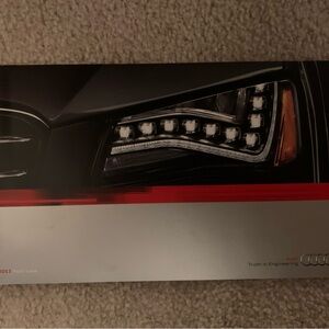 Audi Headlight Brochure Cover with Red Accent